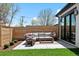 Inviting backyard patio featuring modern outdoor furniture and lush landscaping, ideal for relaxation at 2524 Zenobia St, Denver, CO 80212