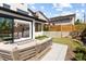 Backyard patio with sleek outdoor seating, manicured lawn, and seamless transition to indoor living at 2524 Zenobia St, Denver, CO 80212