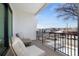 Relaxing balcony seating with a view of the neighborhood and distant mountains on a clear day at 2524 Zenobia St, Denver, CO 80212