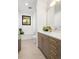 Stylish bathroom features modern fixtures, neutral tile, and a well-lit vanity with lots of storage at 2524 Zenobia St, Denver, CO 80212