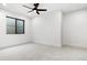 This is a bedroom with white walls and carpet, a modern ceiling fan, and a black-framed window letting in natural light at 2524 Zenobia St, Denver, CO 80212