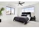 Bright bedroom featuring a modern ceiling fan, windows and sleek furniture at 2524 Zenobia St, Denver, CO 80212