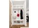 Well-organized entryway with built-in bench, hooks, and shelving for convenient storage of everyday items at 2524 Zenobia St, Denver, CO 80212