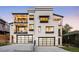 Luxury home exterior showcasing balconies and large garages on a clear evening at 2524 Zenobia St, Denver, CO 80212