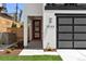 Modern home showcasing a red-framed glass front door with modern architectural details and landscaping at 2524 Zenobia St, Denver, CO 80212