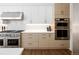 Well-equipped kitchen featuring modern cabinets and stainless steel oven appliance at 2524 Zenobia St, Denver, CO 80212