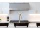 Contemporary kitchen featuring a gold faucet and a view of the stainless steel oven at 2524 Zenobia St, Denver, CO 80212