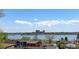 A house with a rooftop view of lake in a neighborhood under a blue sky at 2524 Zenobia St, Denver, CO 80212
