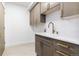 Laundry room featuring shaker cabinets, a white countertop and gold hardware at 2524 Zenobia St, Denver, CO 80212