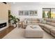 Cozy living room featuring a sectional sofa, decor, and a view of the backyard at 2524 Zenobia St, Denver, CO 80212