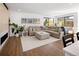 Spacious living room with a large sectional sofa, hardwood floors, and natural light at 2524 Zenobia St, Denver, CO 80212