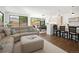 Inviting living room with a comfortable sofa, hardwood floors, and backyard views at 2524 Zenobia St, Denver, CO 80212