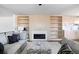 Bright living room with a modern fireplace and built in shelves at 2524 Zenobia St, Denver, CO 80212