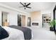 Bright main bedroom with a fireplace, large window, and modern neutral decor at 2524 Zenobia St, Denver, CO 80212
