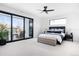 Bright main bedroom featuring a balcony with city views, providing a tranquil retreat at 2524 Zenobia St, Denver, CO 80212