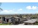 A view of houses in a modern neighborhood near mountains and trees under a blue sky at 2524 Zenobia St, Denver, CO 80212