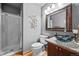 Bathroom featuring glass-enclosed shower, toilet, vanity with vessel sink at 2042 Chesapeake Pl, Highlands Ranch, CO 80126
