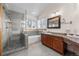 Bathroom featuring glass-enclosed shower, soaking tub, and vanity with countertop at 2042 Chesapeake Pl, Highlands Ranch, CO 80126