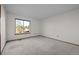 Empty bedroom with carpet flooring, window, and neutral paint color at 2042 Chesapeake Pl, Highlands Ranch, CO 80126