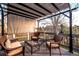 Inviting deck area featuring stylish patio furniture and a retractable awning at 2042 Chesapeake Pl, Highlands Ranch, CO 80126
