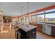 Spacious kitchen with island seating, stainless steel appliances, and ample countertop space at 2042 Chesapeake Pl, Highlands Ranch, CO 80126