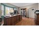 Bright office features a large window with natural light and a wooden desk and bookshelf at 2042 Chesapeake Pl, Highlands Ranch, CO 80126