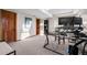 Spacious office with carpeted floors and dark desk with 2 monitors at 2042 Chesapeake Pl, Highlands Ranch, CO 80126