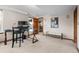 Office space with a black desk and chair, light carpet, and view into hallway at 2042 Chesapeake Pl, Highlands Ranch, CO 80126