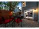 Private brick patio with a modern privacy fence and sliding glass door into home at 2042 Chesapeake Pl, Highlands Ranch, CO 80126