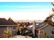 Scenic mountain views from a home with solar panels on the roof and mature trees at 2042 Chesapeake Pl, Highlands Ranch, CO 80126