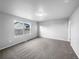 Bright bedroom with carpet flooring and large window at 5242 Longs Peak St, Brighton, CO 80601