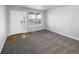Bright living room with carpet flooring and neutral walls at 5242 Longs Peak St, Brighton, CO 80601