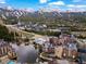 Stunning aerial view of a mountain town with ski slopes, lodging, and a tranquil lake in the foreground at 405 Village Rd # 101, Breckenridge, CO 80424