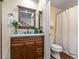 Traditional bathroom with a wood vanity, framed mirror and a shower/tub combination at 405 Village Rd # 101, Breckenridge, CO 80424