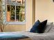 Relaxing bedroom corner with a plush pillow on a made bed next to a bright window at 405 Village Rd # 101, Breckenridge, CO 80424