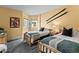 Bright, comfortable bedroom featuring twin beds, natural light, and rustic wood accents at 405 Village Rd # 101, Breckenridge, CO 80424