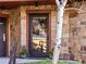 Private residence entrance with stone accents and a reflecting glass door at 405 Village Rd # 101, Breckenridge, CO 80424
