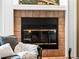 Close-up of a cozy fireplace with tile surround, creating a warm and inviting ambiance at 405 Village Rd # 101, Breckenridge, CO 80424