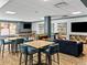 Spacious game room with a pool table, foosball table, and comfortable seating for entertainment at 405 Village Rd # 101, Breckenridge, CO 80424