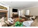 Spacious living room with a cozy fireplace, offering a relaxing atmosphere for entertaining or relaxing at 405 Village Rd # 101, Breckenridge, CO 80424