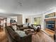 Comfortable living room featuring a fireplace, large sectional, and views of the outdoors at 405 Village Rd # 101, Breckenridge, CO 80424