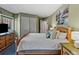 Comfortable bedroom with a wood bed frame, and natural light from the window at 405 Village Rd # 101, Breckenridge, CO 80424