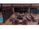 Relaxing indoor/outdoor lounge area with a fire pit, comfy seating and pool views at 405 Village Rd # 101, Breckenridge, CO 80424