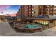 Inviting outdoor pool area with comfortable seating and a glimpse of the building's exterior at 405 Village Rd # 101, Breckenridge, CO 80424
