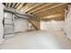 Unfinished basement with exposed pipes and framing at 7312 Watercress Dr, Littleton, CO 80125