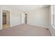 Spacious bedroom with neutral carpeting and ample closet space at 7312 Watercress Dr, Littleton, CO 80125