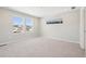 Bright and airy bedroom with neutral carpet and large windows at 7312 Watercress Dr, Littleton, CO 80125