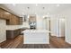 Modern kitchen with island, stainless steel appliances and wood cabinets at 7312 Watercress Dr, Littleton, CO 80125