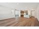 Living room, kitchen and stairs view with hardwood floors at 7312 Watercress Dr, Littleton, CO 80125