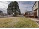 Large backyard with grassy area and deck at 1455 S Vaughn Cir, Aurora, CO 80012